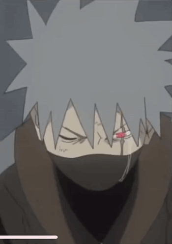 A Close Up Of A Cartoon Character With A Mask On His Face And A Red Eye . GIF