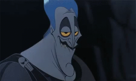 A Close Up Of A Cartoon Character With A Very Angry Face And Yellow Eyes . GIF