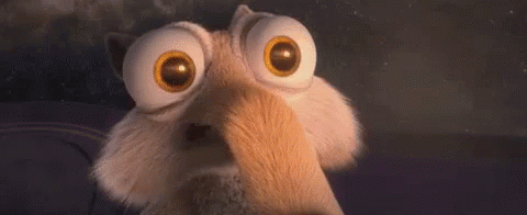 A Close Up Of A Cartoon Character With Big Eyes And A Surprised Look On His Face . GIF