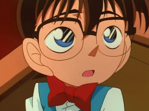 A Close Up Of A Cartoon Character With Glasses And A Red Bow Tie GIF