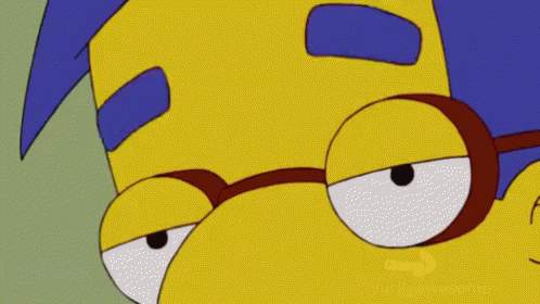 A Close Up Of A Cartoon Character With Glasses On GIF
