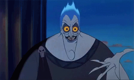 A Close Up Of A Cartoon Character With Glowing Eyes And A Skull On His Shoulder . GIF