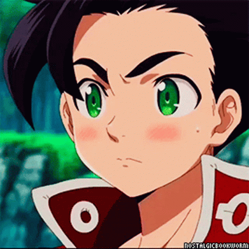 A Close Up Of A Cartoon Character With Green Eyes And A Red Jacket With The Letter O On It GIF