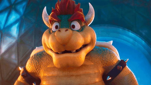 a close up of a cartoon character with horns and spikes on his arms
