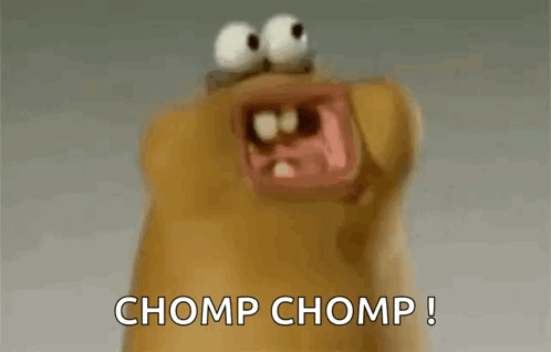 A Close Up Of A Cartoon Character With Its Mouth Open And The Words Chomp Chomp Written On The Bottom GIF