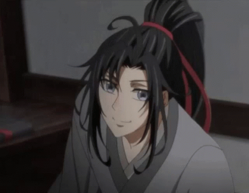 A Close Up Of A Cartoon Character With Long Black Hair And A Ponytail GIF