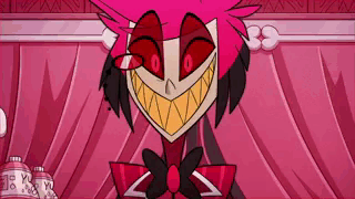 A Close Up Of A Cartoon Character With Red Eyes And A Big Smile . GIF