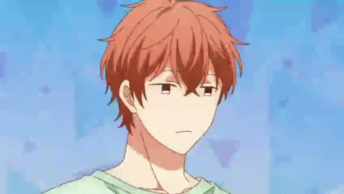 A Close Up Of A Cartoon Character With Red Hair And The Words `` Tsk '' Written On His Face . GIF
