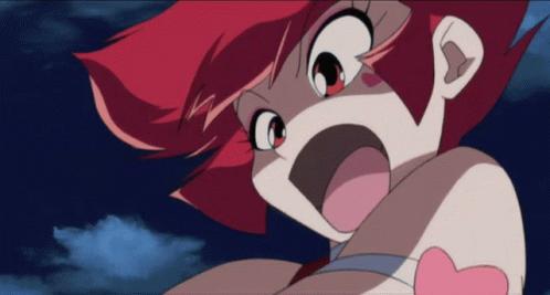 A Close Up Of A Cartoon Character With Red Hair GIF