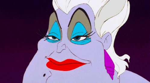 A Close Up Of A Cartoon Character With Red Lips And Blue Eyeshadow GIF