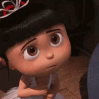 A Close Up Of A Cartoon Doll Wearing A Tiara And A White Dress . GIF