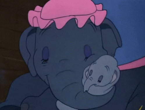 A Close Up Of A Cartoon Elephant With A Pink Hat On Its Head GIF
