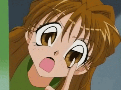 a close up of a cartoon girl 's face with a surprised expression on her face