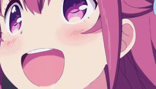A Close Up Of A Cartoon Girl With Pink Hair And Purple Eyes Smiling . GIF