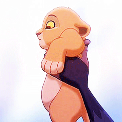 A Close Up Of A Cartoon Lion Holding Another Lion GIF