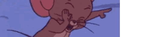 a close up of a cartoon mouse covering its mouth with its hand .