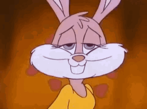 A Close Up Of A Cartoon Rabbit Wearing A Yellow Shirt And Smiling . GIF