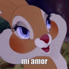 A Close Up Of A Cartoon Rabbit With The Words `` Mi Amor '' On It . GIF