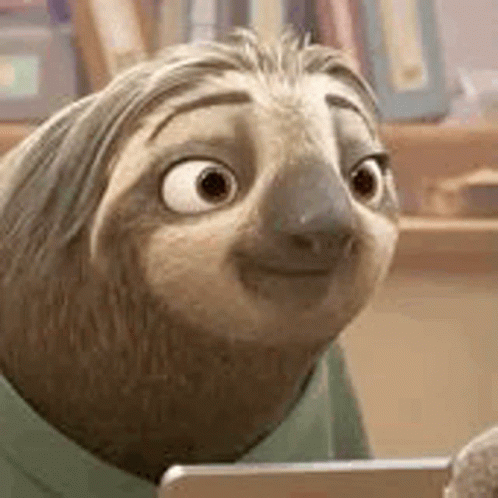 A Close Up Of A Cartoon Sloth Looking At A Tablet Computer . GIF