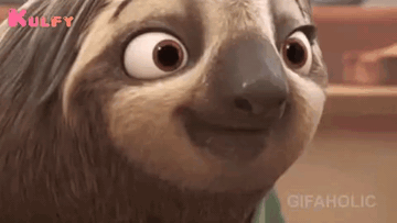 A Close Up Of A Cartoon Sloth Making A Funny Face And Smiling . GIF