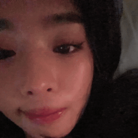 A Close Up Of A Cat 'S Face Looking At The Camera GIF