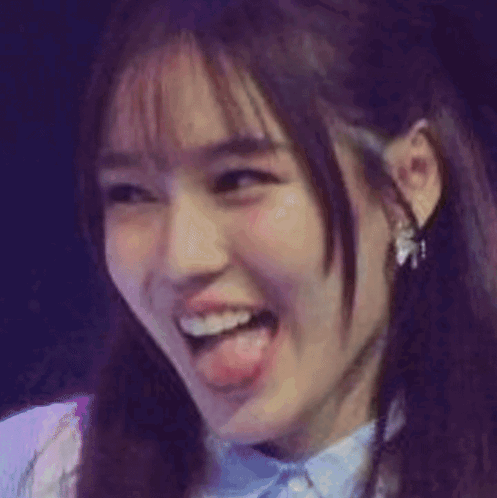 A Close Up Of A Cat 'S Face With Its Tongue Out GIF