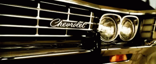 A Close Up Of A Chevrolet Car 'S Grill GIF