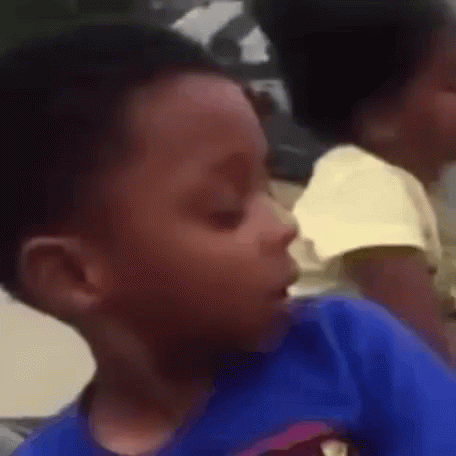 A Close Up Of A Child 'S Face With A Blurry Background GIF