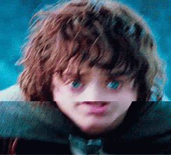 A Close Up Of A Child 'S Face With Blue Eyes GIF