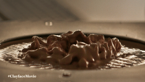 A Close Up Of A Clayface Movie Advertisement GIF