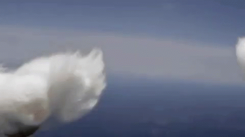 A Close Up Of A Cloud In The Sky With A Blue Sky In The Background . GIF