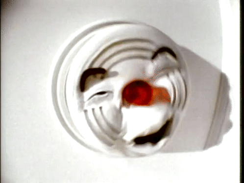 A Close Up Of A Clown 'S Face On A White Background GIF