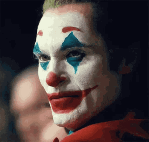 Clown Face With Red White And Blue Makeup GIF