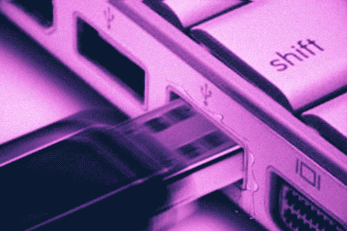 A Close Up Of A Computer Keyboard With The Shift Key Visible GIF