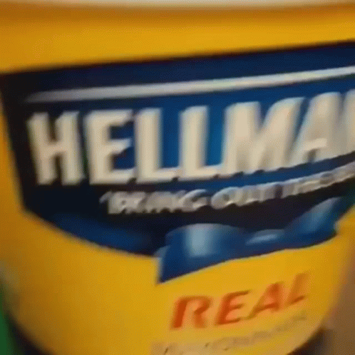A Close Up Of A Container Of Hellmans Mayonnaise GIF