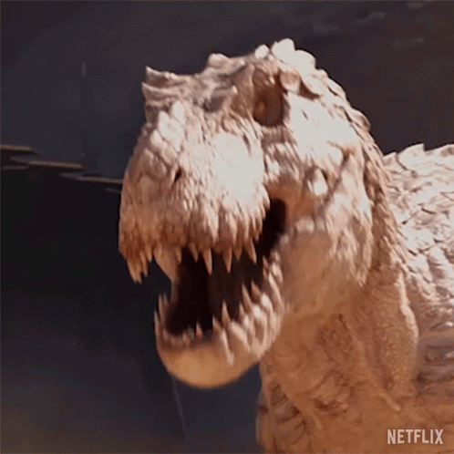 A Close Up Of A Dinosaur With Its Mouth Open And The Word Netflix On The Bottom Right GIF