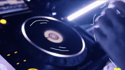 A Close Up Of A Dj 'S Turntable That Says Pioneer GIF