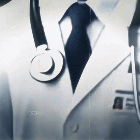 A Close Up Of A Doctor With A Stethoscope On His Jacket GIF