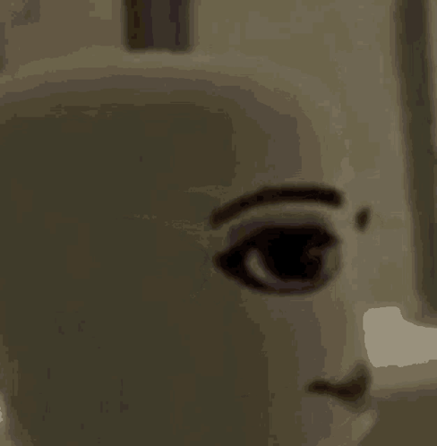 a close up of a doll 's face with a smile .