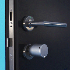 A Close Up Of A Door With A Handle And A Key GIF