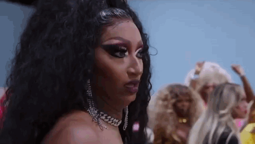 Close Up Of Drag Queen Wearing Choker And Earrings GIF