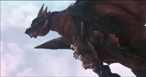 A Close Up Of A Dragon Flying Through The Air . GIF