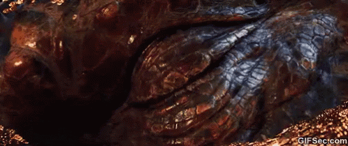 A Close Up Of A Dragon 'S Eye With The Website Gifsec.com Visible GIF
