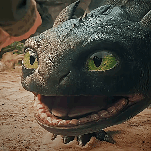 A Close Up Of A Dragon 'S Face With Its Mouth Wide Open GIF