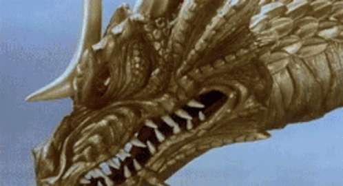 A Close Up Of A Dragon 'S Head With A Blue Sky In The Background GIF