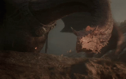 A Close Up Of A Dragon 'S Head With A Very Long Neck GIF
