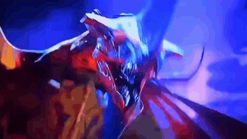A Close Up Of A Dragon With A Blue Background GIF