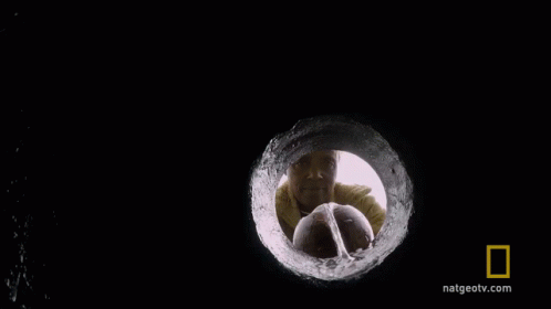 A Close Up Of A Drop Of Water With The National Geographic Logo On The Bottom GIF