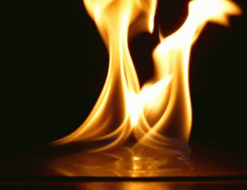a close up of a flame on a black background