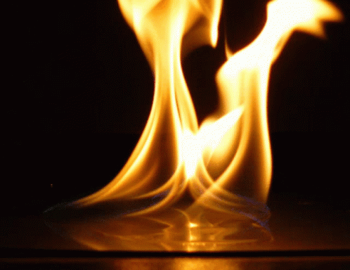 A Close Up Of A Flame With The Letter M Visible GIF